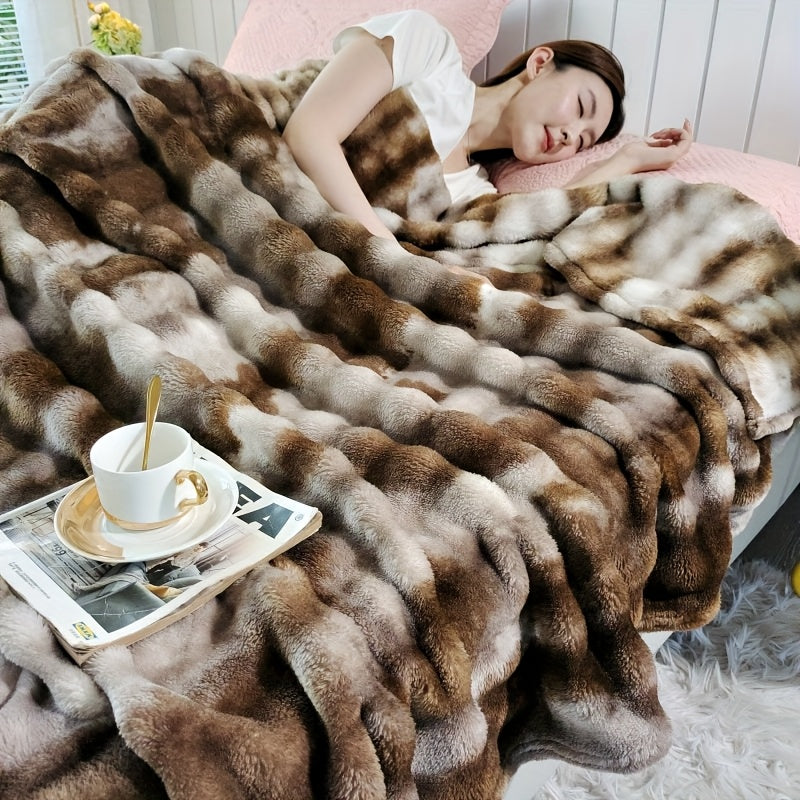 Soft and plush faux fur throw blanket for ultimate luxury and comfort. Perfect for cozying up on the couch or adding a touch of elegance to your bedroom or living room. Machine washable for easy care, suitable for all seasons. Measures 99.06x149.86cm.