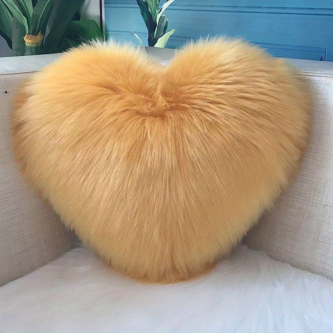 Heart-shaped throw pillow for living room or bedroom, made of long plush material for softness and comfort.