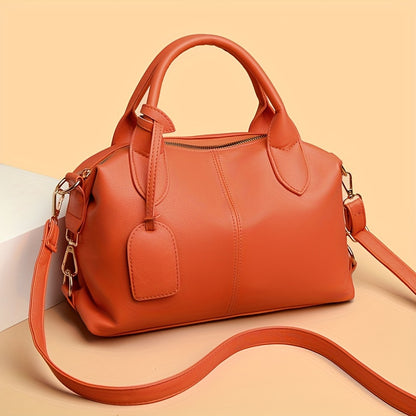 Stylish shoulder bag with removable strap and zip closure, perfect for everyday use.