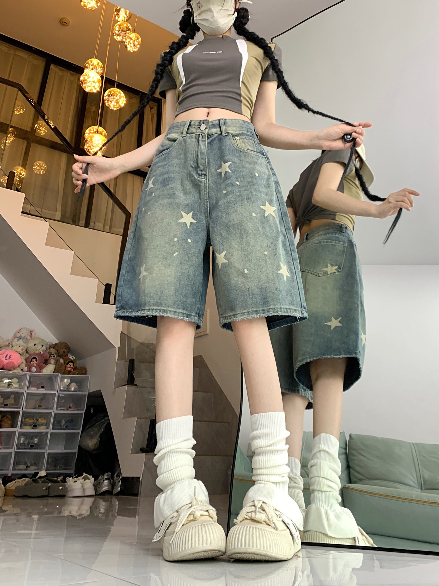 Women's casual denim shorts with star pattern, button fly, loose fit, slight stretch, and washed jeans for summer street style. Made of 70% cotton and 30% polyester.