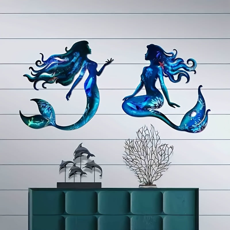 Ocean-themed metal mermaid wall art for indoor or outdoor nautical decor.