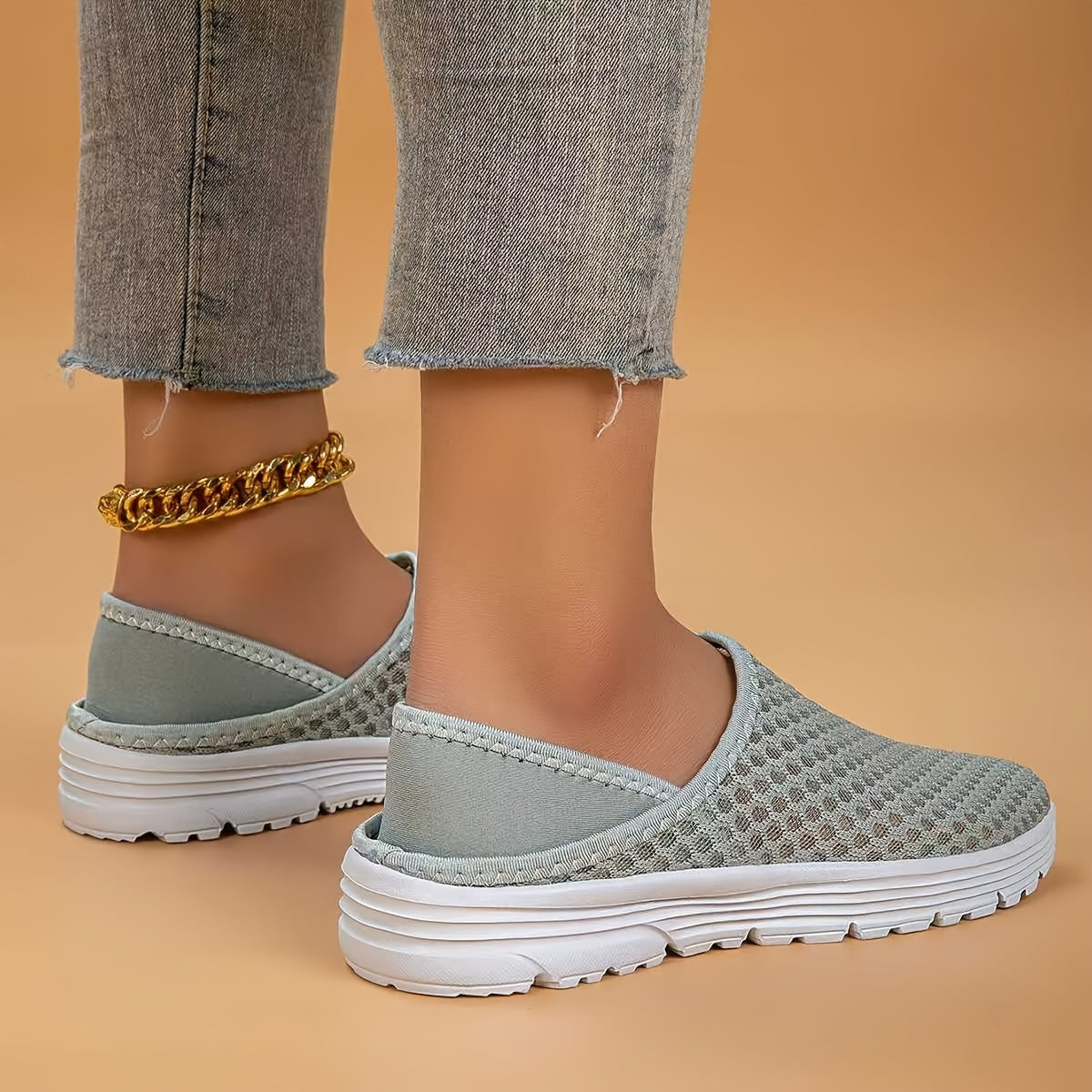 Mesh slip-on walking shoes with stability support, lightweight white summer footwear.