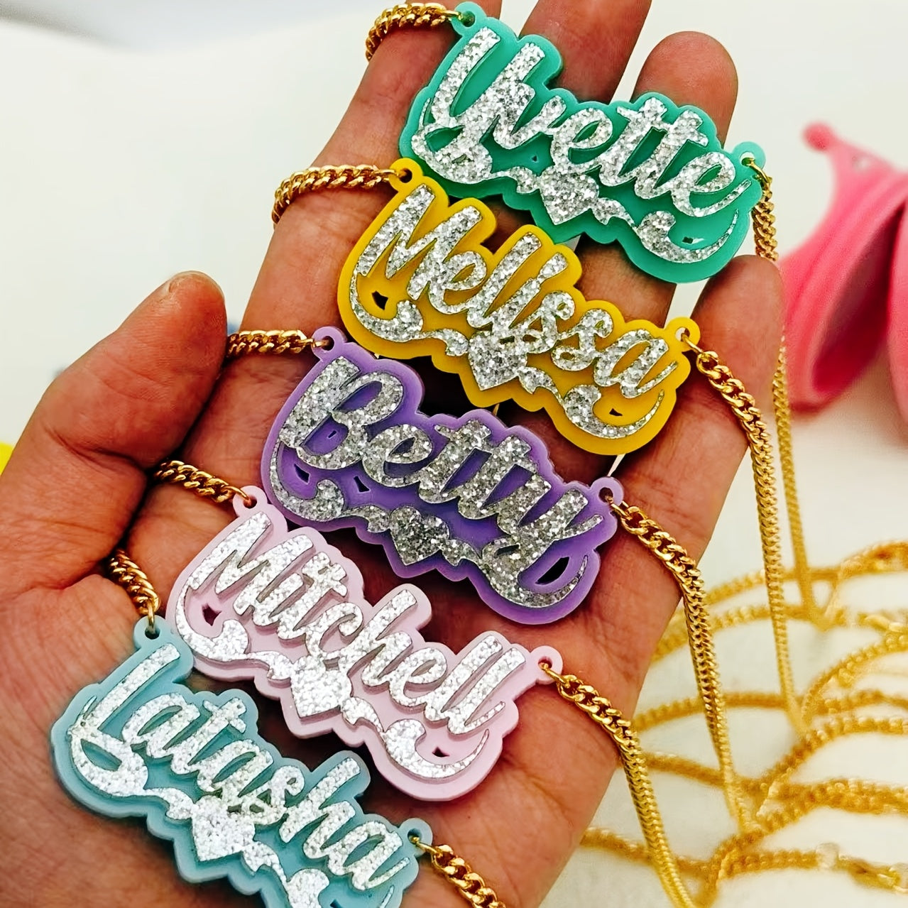 Personalize your style with a custom sparkling acrylic name necklace, adorned with a heart-shaped lace and personalized English nameplate. Available in a variety of colors, this classic piece is perfect for women looking to add a unique touch to their