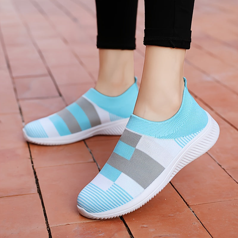 Breathable mesh slip-on sneakers for plus size women in pink, gray, and white plaid with soft sole and round toe design, suitable for all seasons.