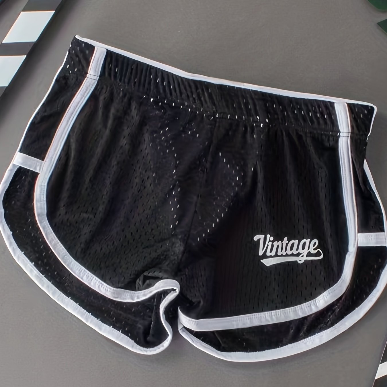 Breathable mesh boxer briefs for men with a comfort fit and contrast trim, suitable for everyday wear and sleepwear.