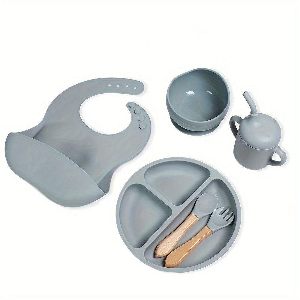 6-piece silicone feeding set with strong suction includes divided plate, wooden spoon and fork, microwave safe - great for self-feeding.