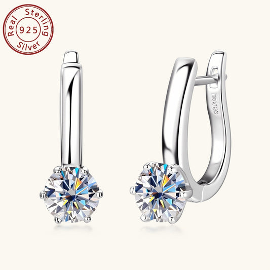 These beautiful earrings feature round Mozambique stone earrings with a stunning D Color, set in 6.5mm sterling silver. The six-claw U-shaped 925 silver ear cuffs add an elegant touch to these ladies' jewelry gifts. The silvery weight of these earrings