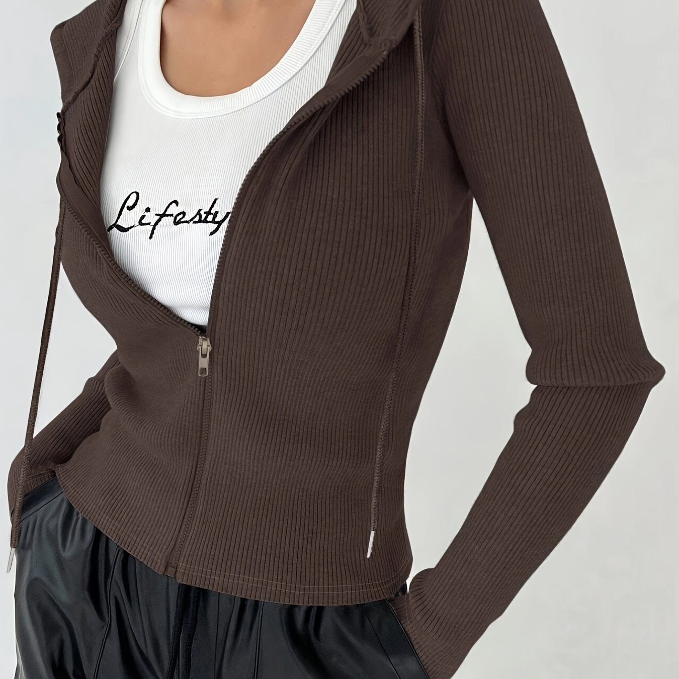 Women's slim fit hooded jacket with ribbed knit, drawstrings, and zip-up closure, made of lightweight polyester blend for fall/winter. Solid color casual style.