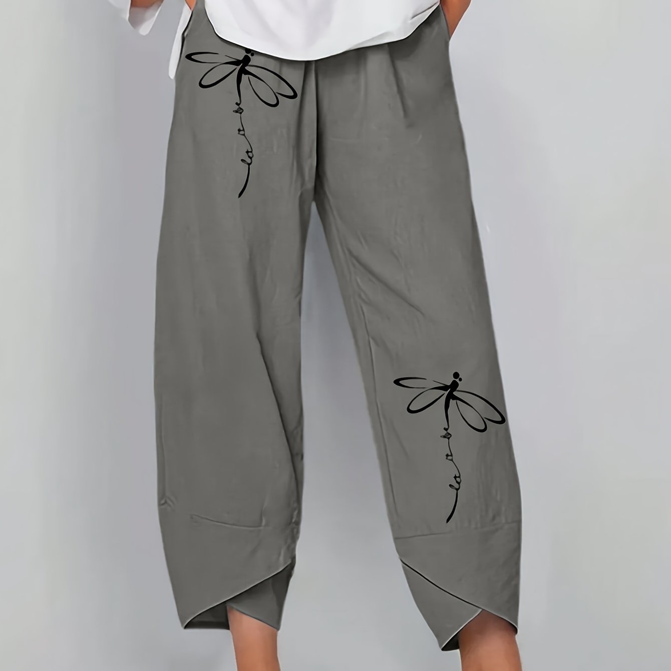 Baggy pants with dandelion print for plus size women, suitable for spring and fall.