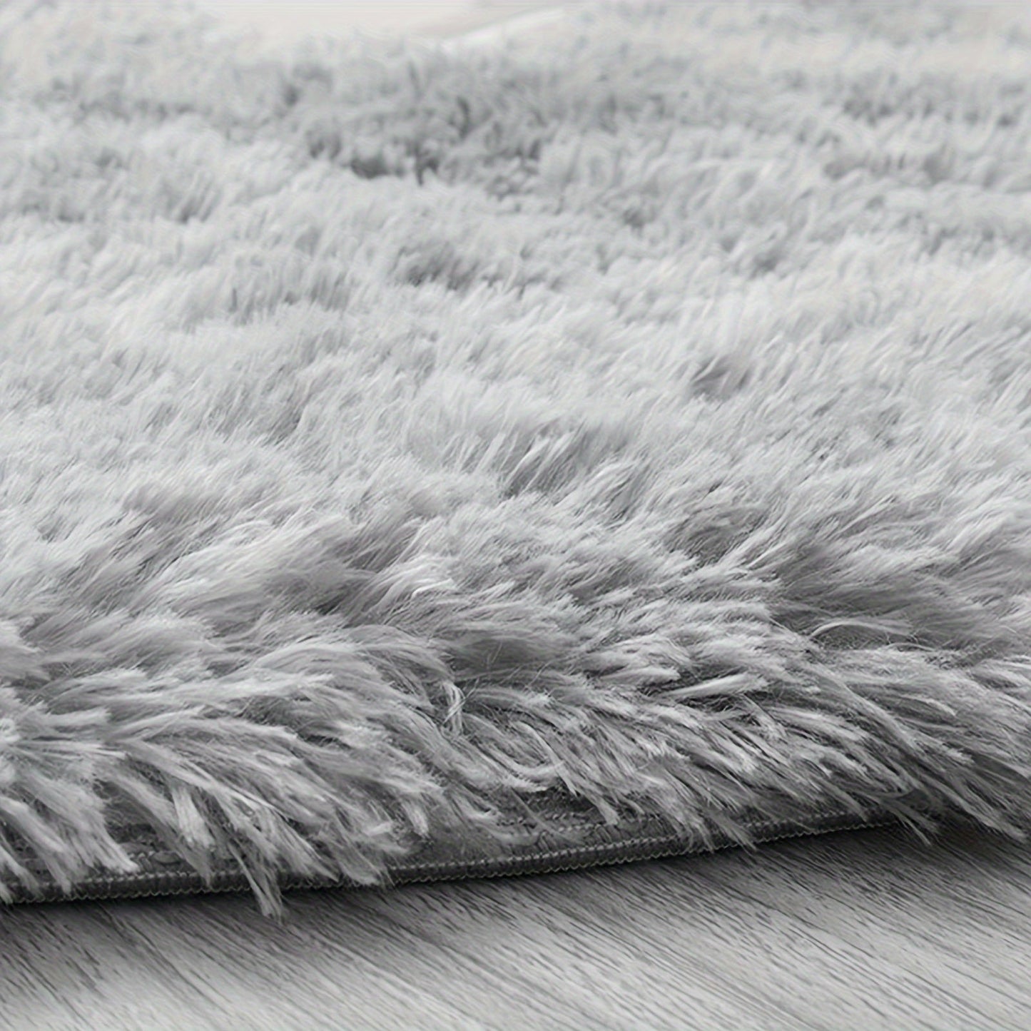 Luxurious soft plush shag area rug perfect for the living room, fluffy shaggy floor carpet ideal for the bedroom. This home decor piece adds warmth and style to any space. Non-slip and machine washable, it's perfect for the living room, bedroom, game