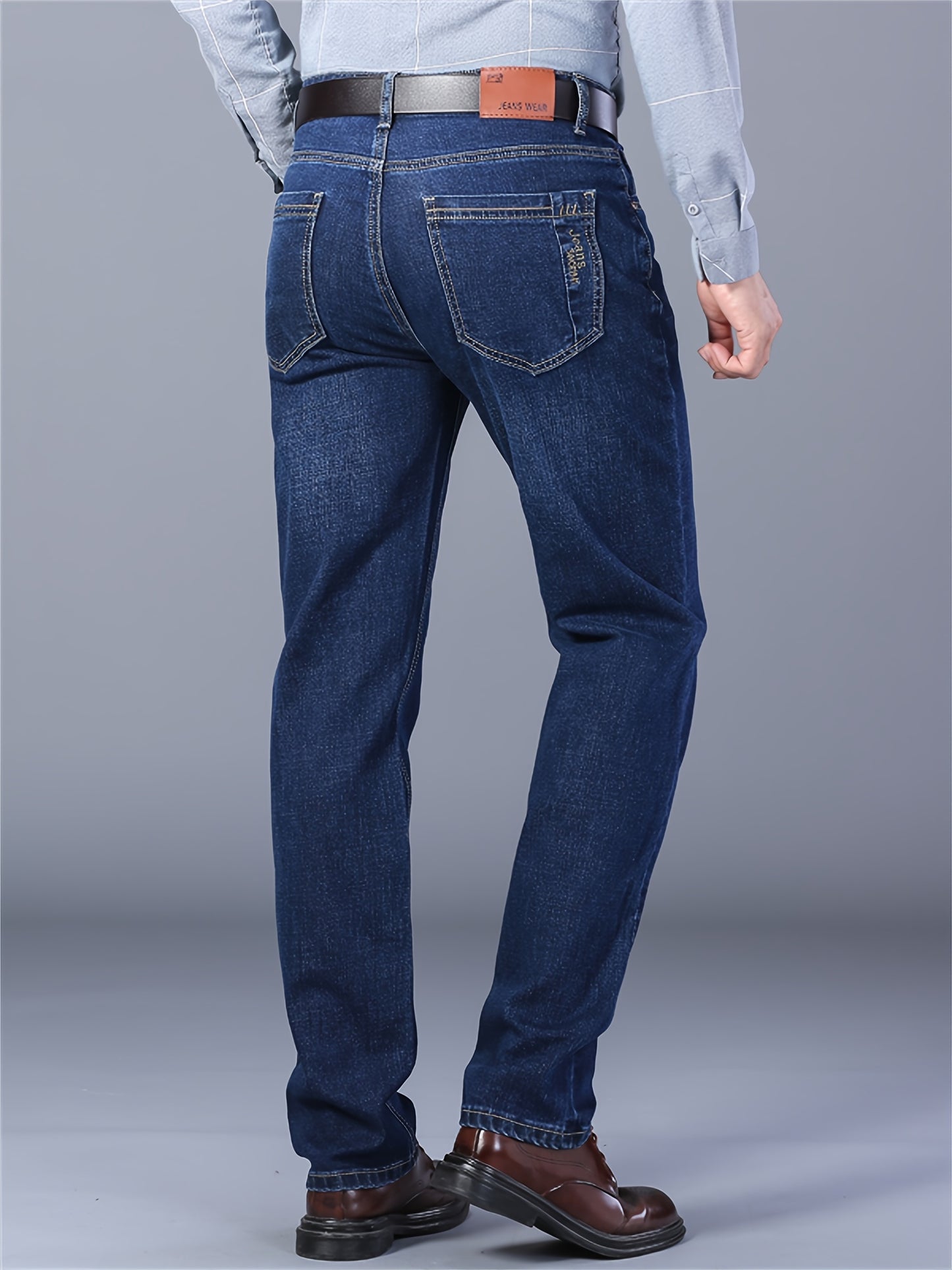 Men's casual cotton blend jeans with pockets, ideal for outdoor activities.