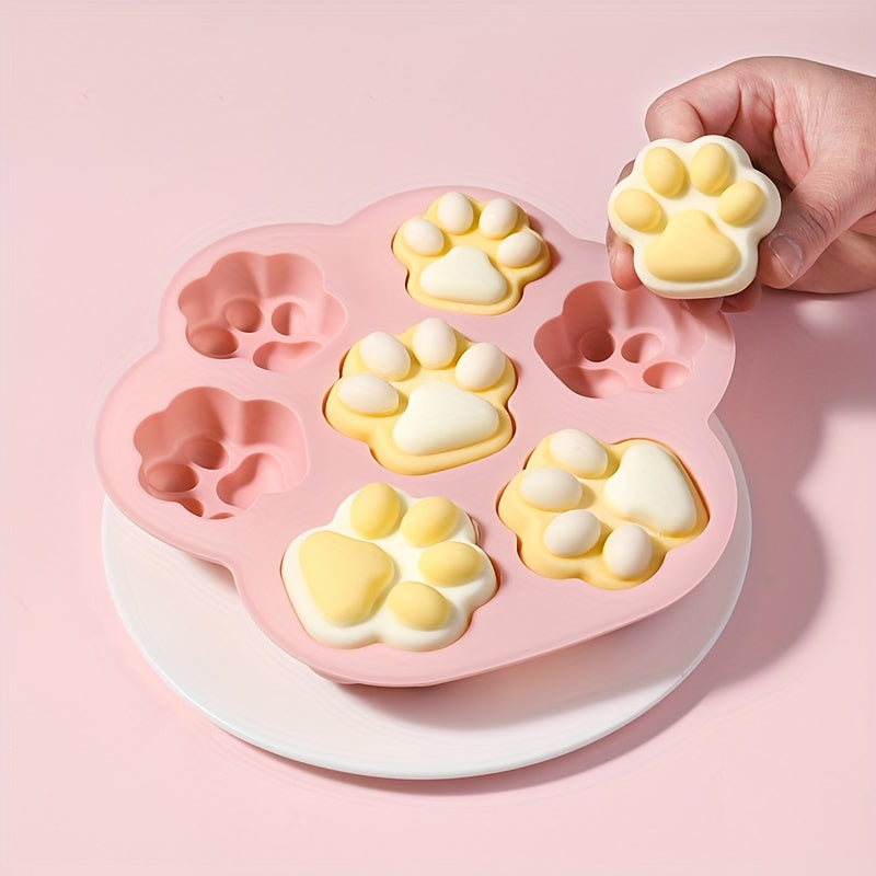 Pink Silicone Paw Print Treat Mold with 7 cavities - non-stick, food-grade silicone for baking a variety of treats including dog treats, cookies, candy, chocolate, and jelly. Perfect for baking with silicone molds.