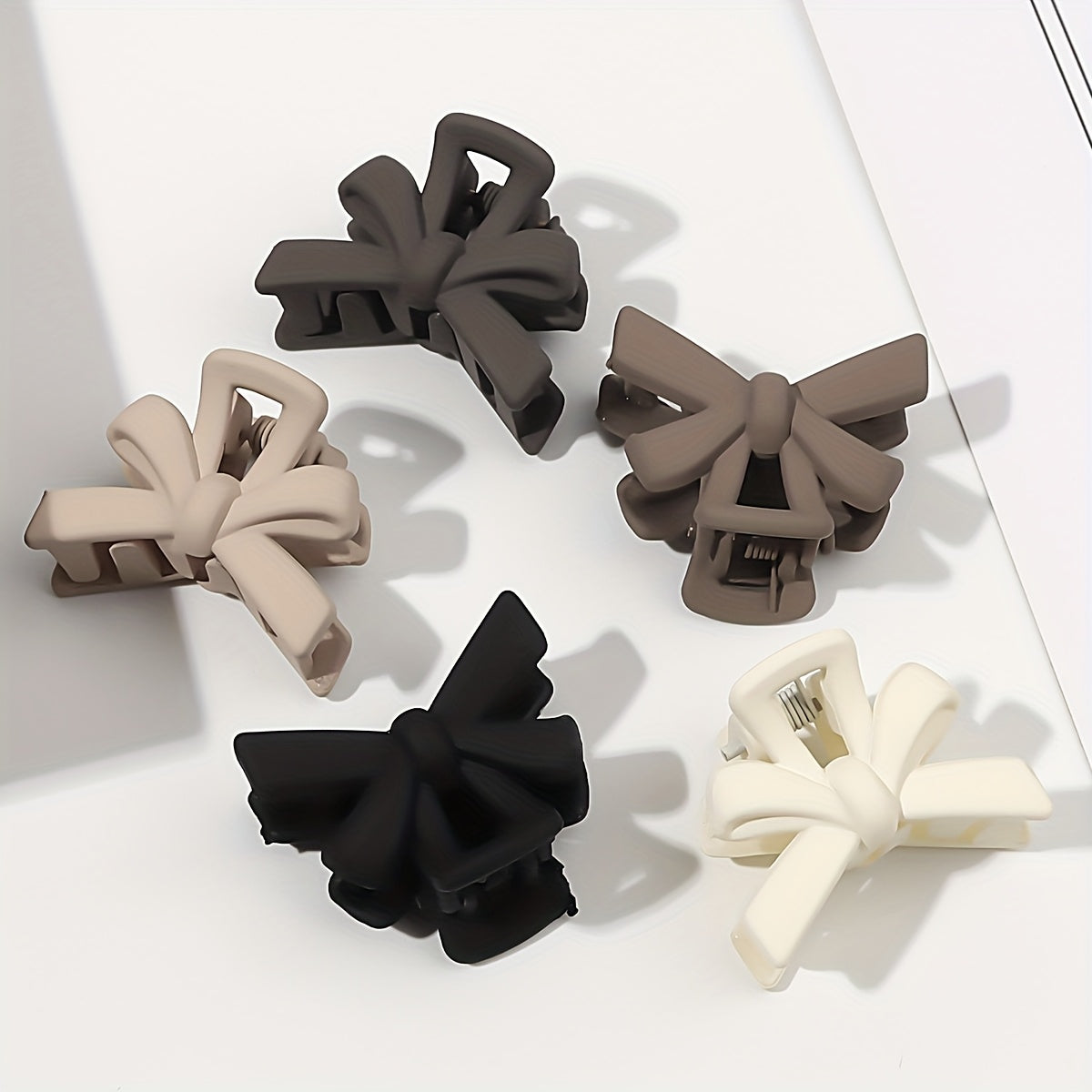 5 small 2.7cm frosted black hair clips with bow design, durable plastic, versatile for princess hairstyles.