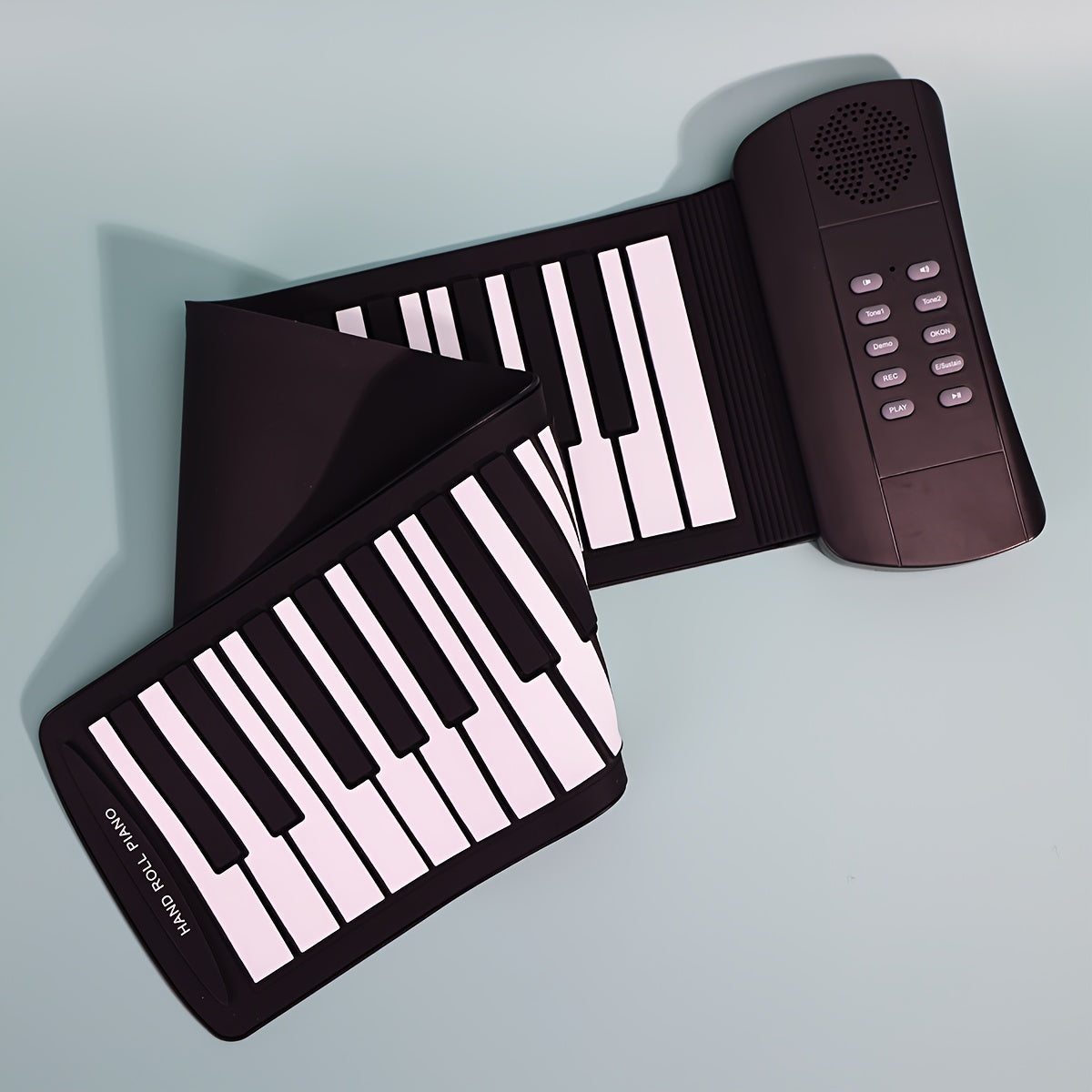 Micro Poly 49-Key Portable Roll-Up Piano Keyboard with Silicone Keys in Black. USB & Battery Powered, Ideal for Beginners. Compact and Easy to Carry Design, Perfect for Home Use. Includes