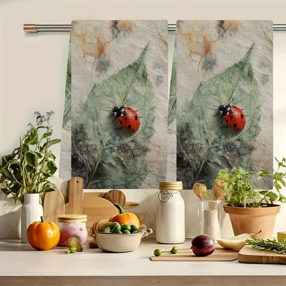 Two Coastal Style Ladybug Kitchen Towels made of highly absorbent polyester knit fabric. These machine washable hand towels are designed in a contemporary oblong shape, perfect for holiday decor. Each towel measures 40.64x60.96 cm and is ideal for drying