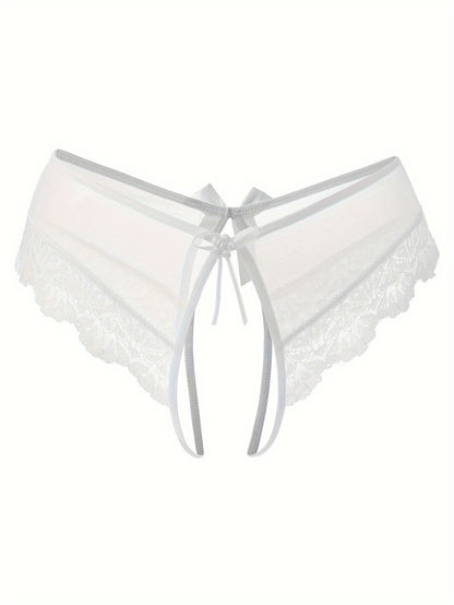 Transparent lace thong briefs with open crotch, low-rise design. Made of 90% polyamide and 10% elastane knit fabric, weighing 111 gsm.