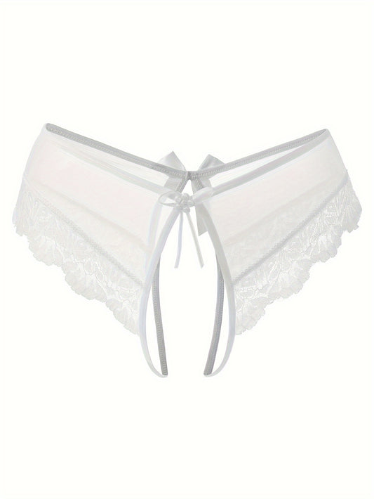 Transparent lace thong briefs with open crotch, low-rise design. Made of 90% polyamide and 10% elastane knit fabric, weighing 111 gsm.