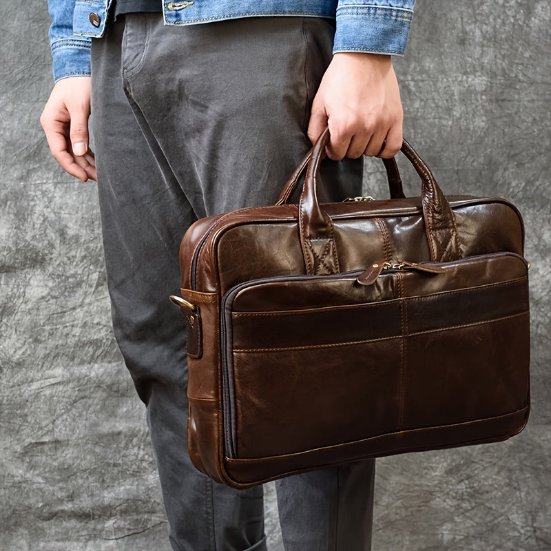 Men's genuine leather briefcase with laptop compartment, adjustable shoulder strap, zipper closure, and polyester lining for office and daily commute.