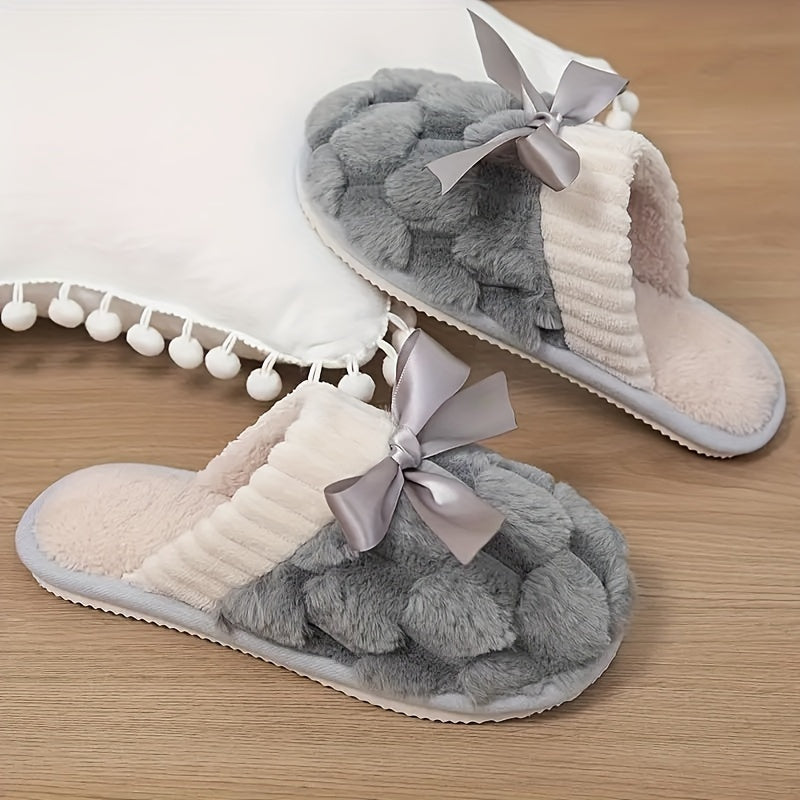 Winter plush cozy non-slip shoes with soft sole and flat bowknot decoration, ideal for home warmth.