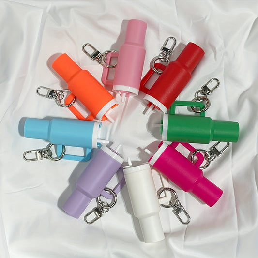 Set of 6/11 novelty tumbler-style keychains made of PVC. These keychains can hold lipsticks and small items, making them perfect for travel, parties, and festivals. This unplated simple plastic keyring set comes in assorted colors, making it an ideal