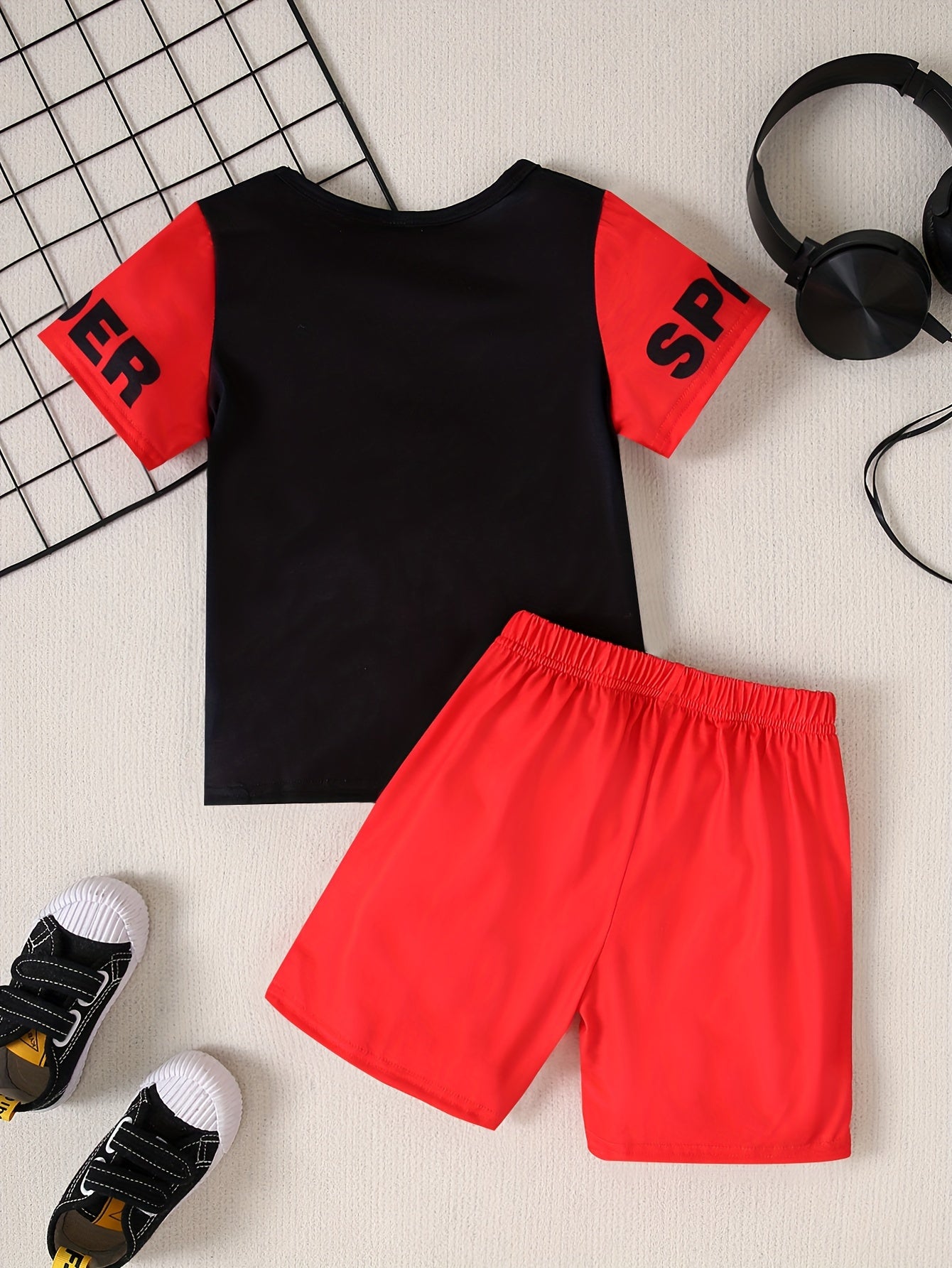 Boys 2-piece casual outfit set with spider web print tee and shorts for summer wear.