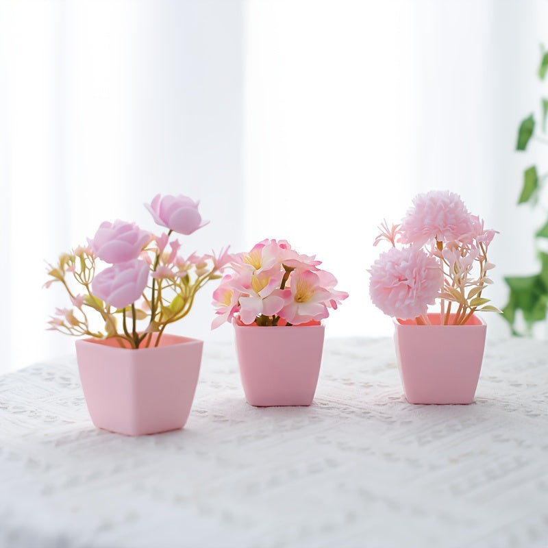 3 mini pink potted plants with faux rose and peach embroidered ball flowers for wedding, home, or office decoration.