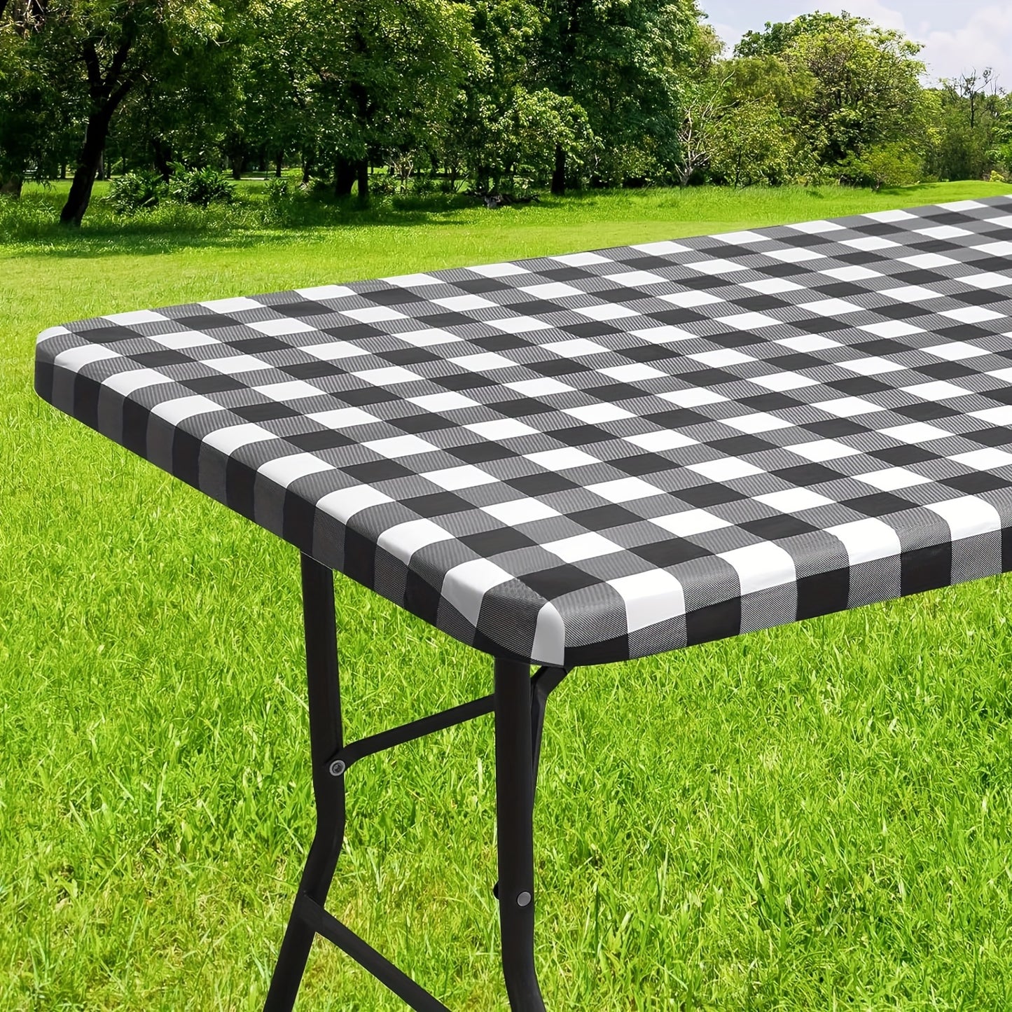 Waterproof vinyl table cover with flannel backing and elastic edge, featuring a gray and white geometric pattern. Ideal for indoor and outdoor use on home patio. Machine-woven fabric with easy-clean surface.