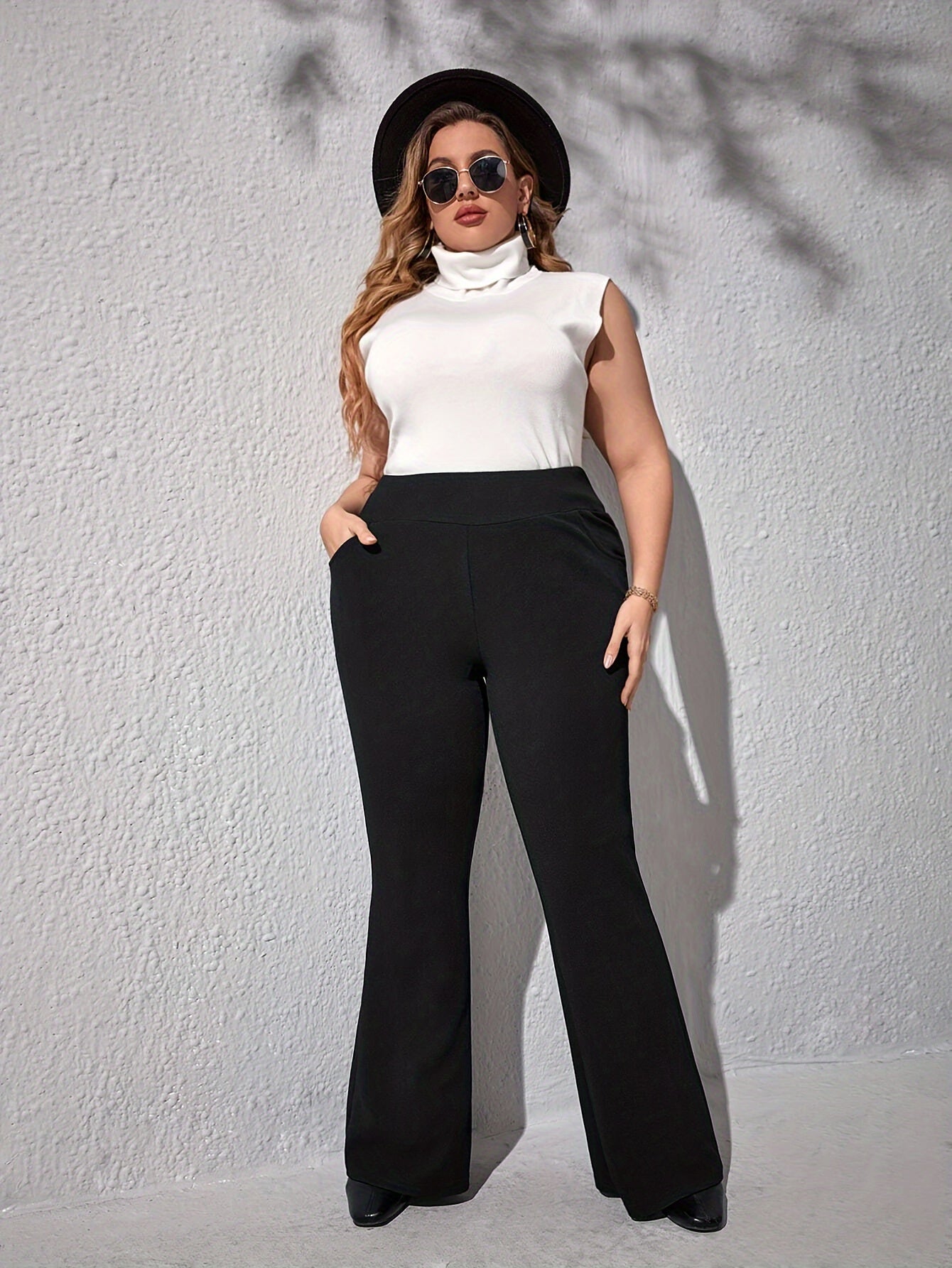 Elegant high-waist flare pants for plus size, with slant pockets, stretch knit, and machine washable - ideal for spring and fall.