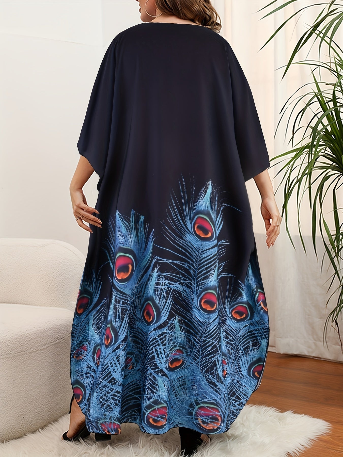 Plus size kaftan dress for women with V-neck print and short batwing sleeves. Loose fit with long length, slit, and made from polyester and elastane. Ideal for spring, summer, and fall