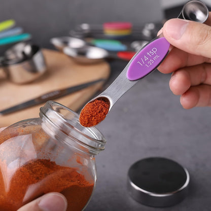 The 23-piece Black Stainless Steel Measuring Cups and Spoons Set includes 8 stackable measuring cups, 8 double-sided magnetic measuring spoons, 1 level, 5 mini spoons, and 1 conversion table. Perfect for measuring both dry and liquid ingredients.