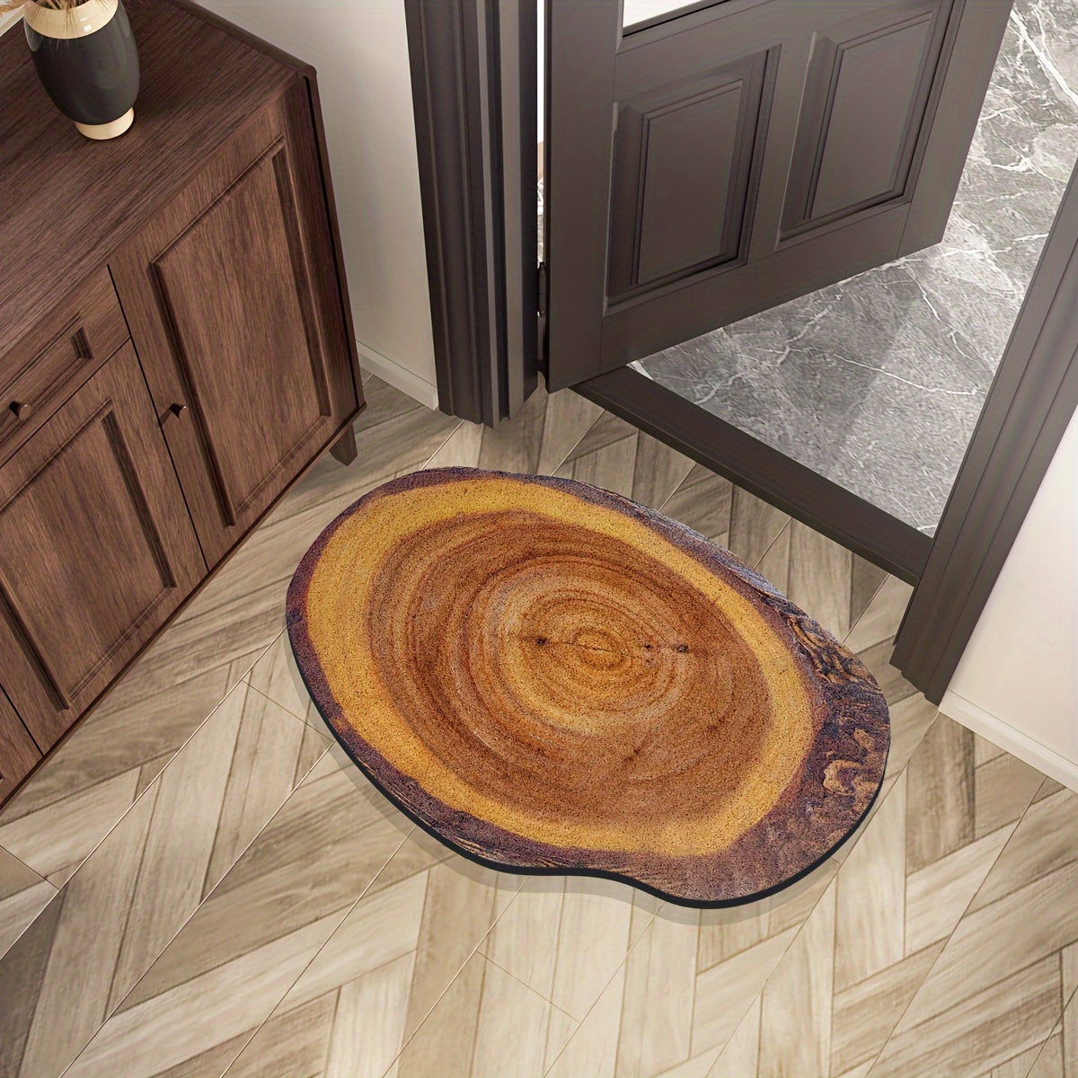 Wood Grain Tree Ring Design Indoor Doormat featuring a non-slip rubber backing for added safety. This decorative floor mat is made from machine-made polyester and is hand-washable. The low pile entry rug is flame resistant, making it perfect for use in