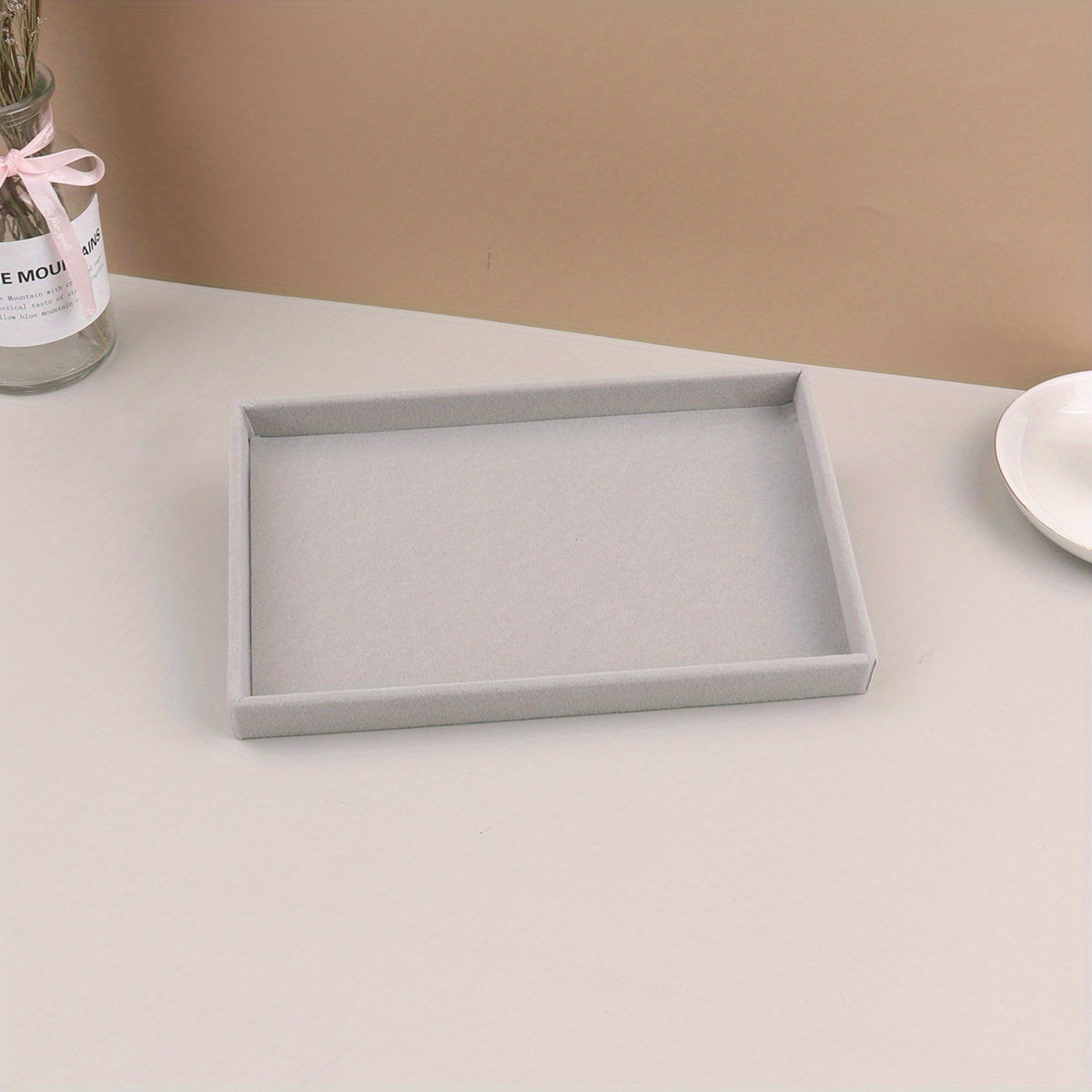 1 piece Grey Velvet Jewelry Tray with compartments for necklaces, bracelets, earrings, rings, bangles, and watches, with a velvet drawer for organization.