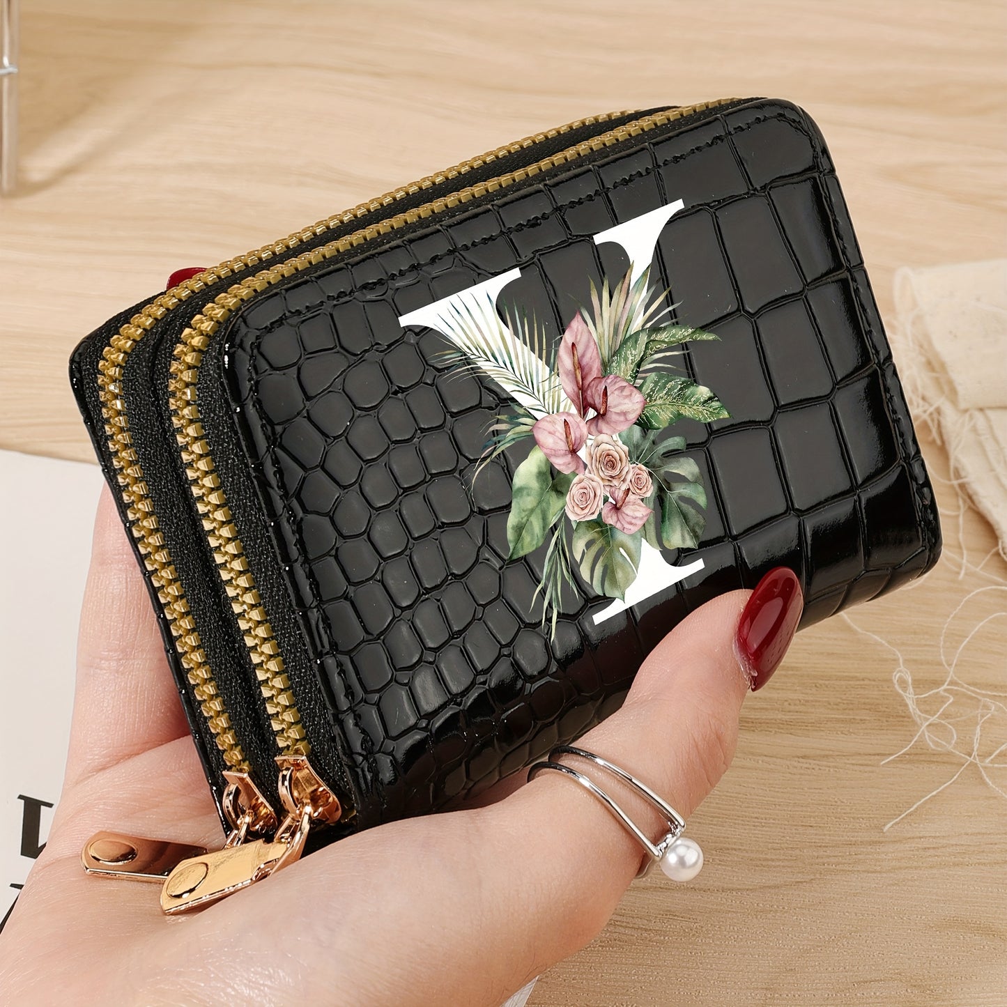 Women's credit card wallet with elegant floral letter print in black & white. Features large capacity, dual zipper, crocodile texture PU, lightweight design with nylon lining for everyday