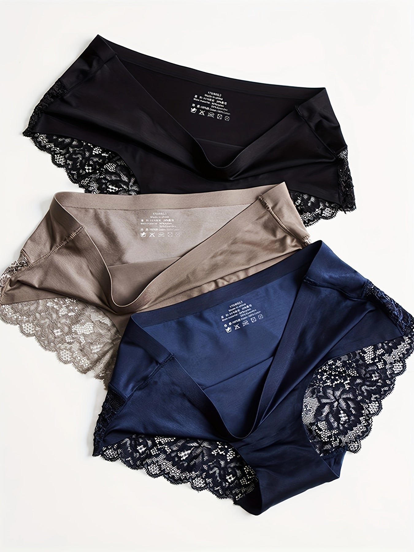 Three comfortable and breathable panties - lace, satin, and smooth lingerie.