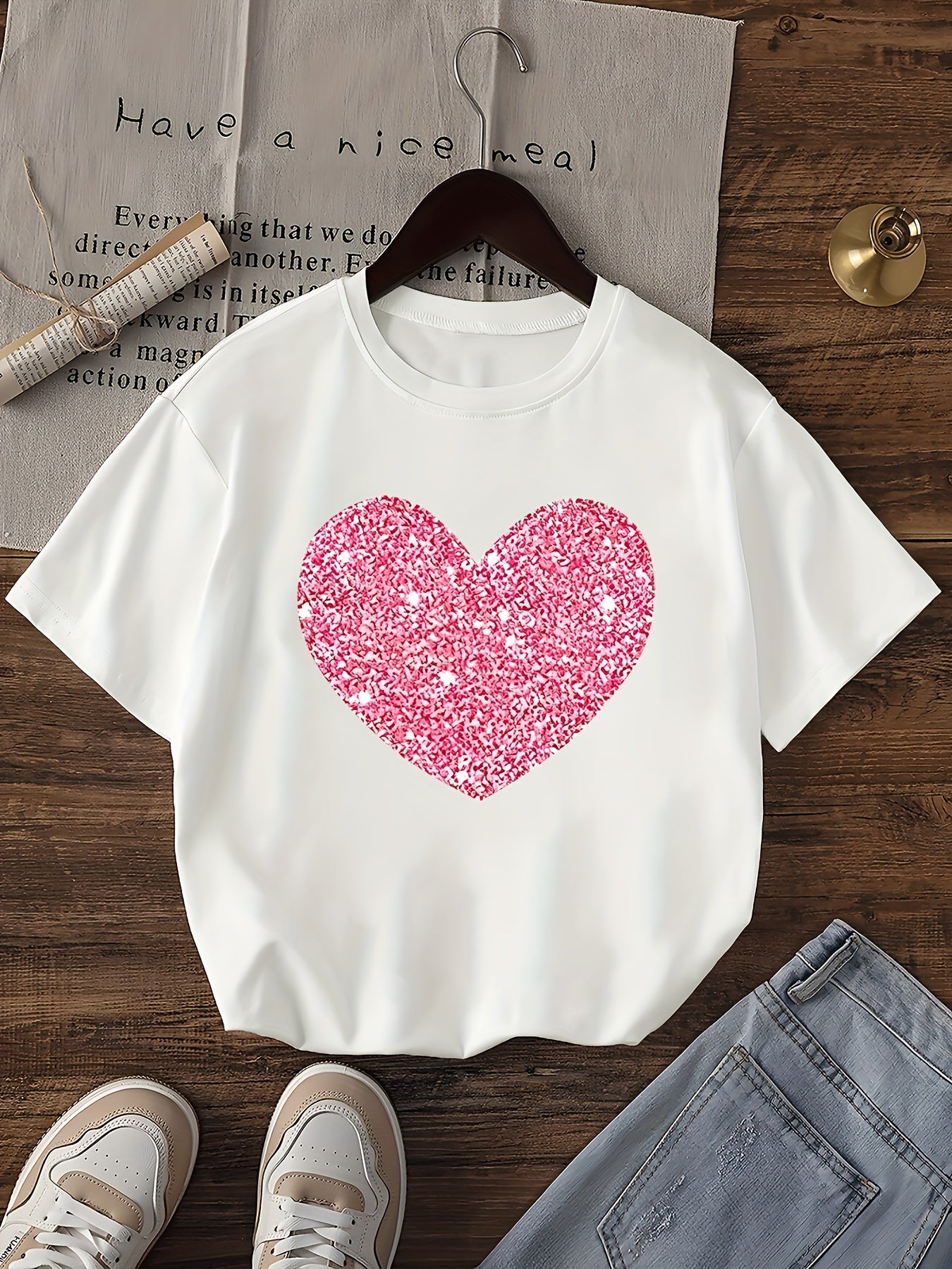 Bright orange girls' tee with pink heart design, comfy polyester blend, perfect for summer outings.