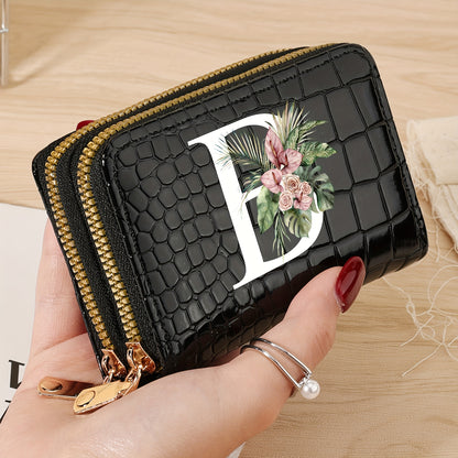 Women's credit card wallet with elegant floral letter print in black & white. Features large capacity, dual zipper, crocodile texture PU, lightweight design with nylon lining for everyday