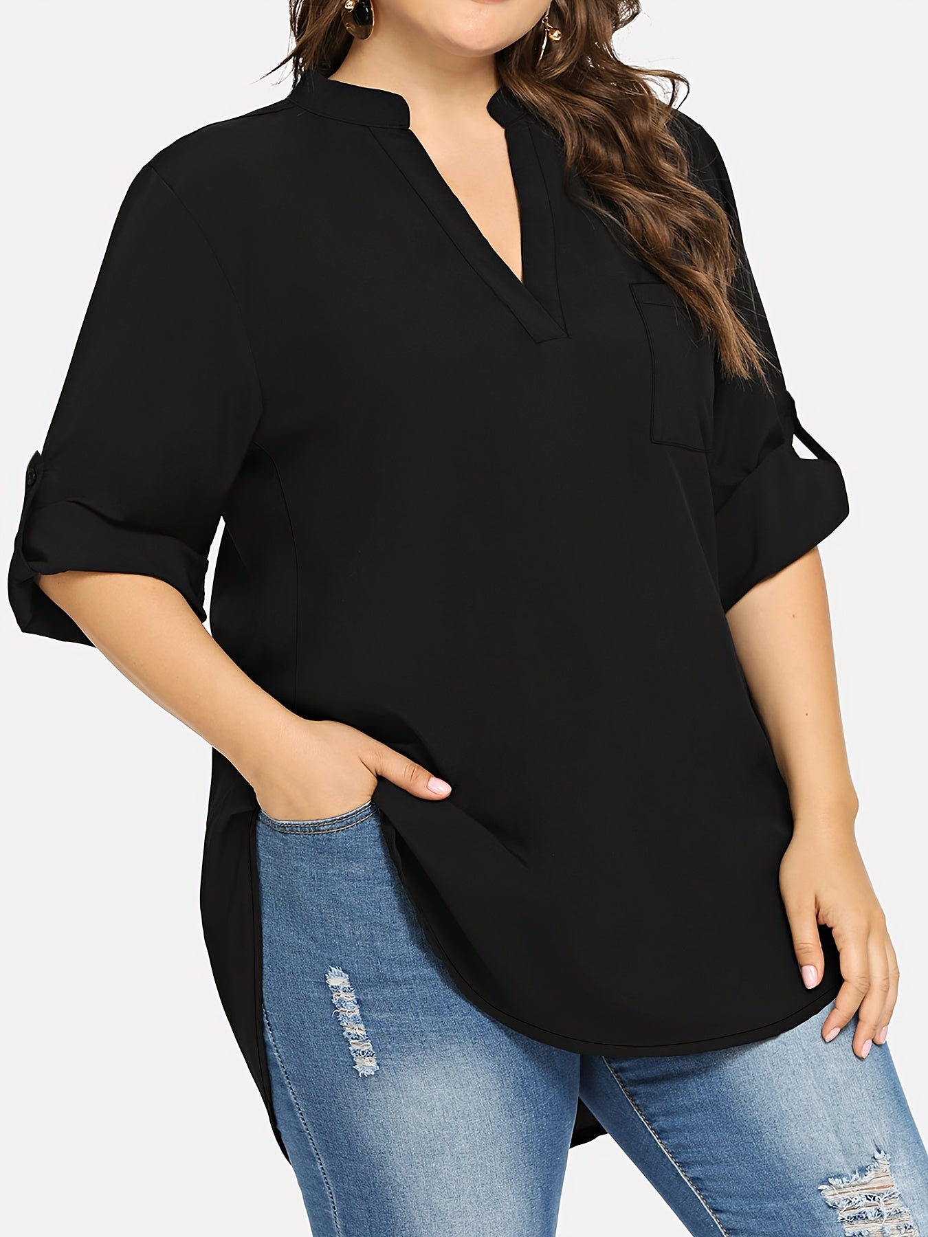 Women's plus size V-neck tunic top with long sleeves. Made of solid color polyester blend in a loose fit style, featuring a front short back long design with an H-line silhouette suitable