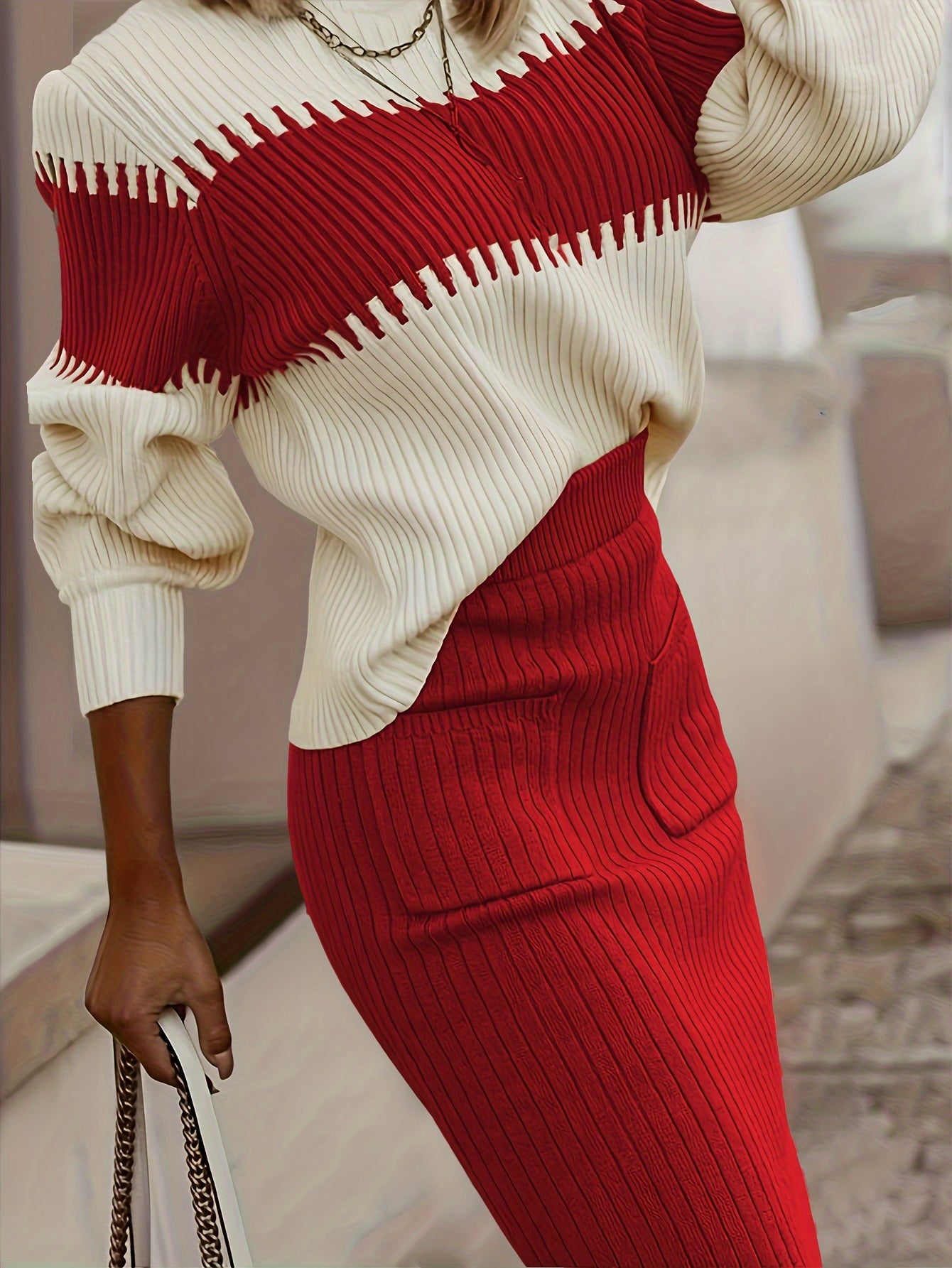 Casual ribbed two-piece set with color block knit sweater and solid midi skirt.