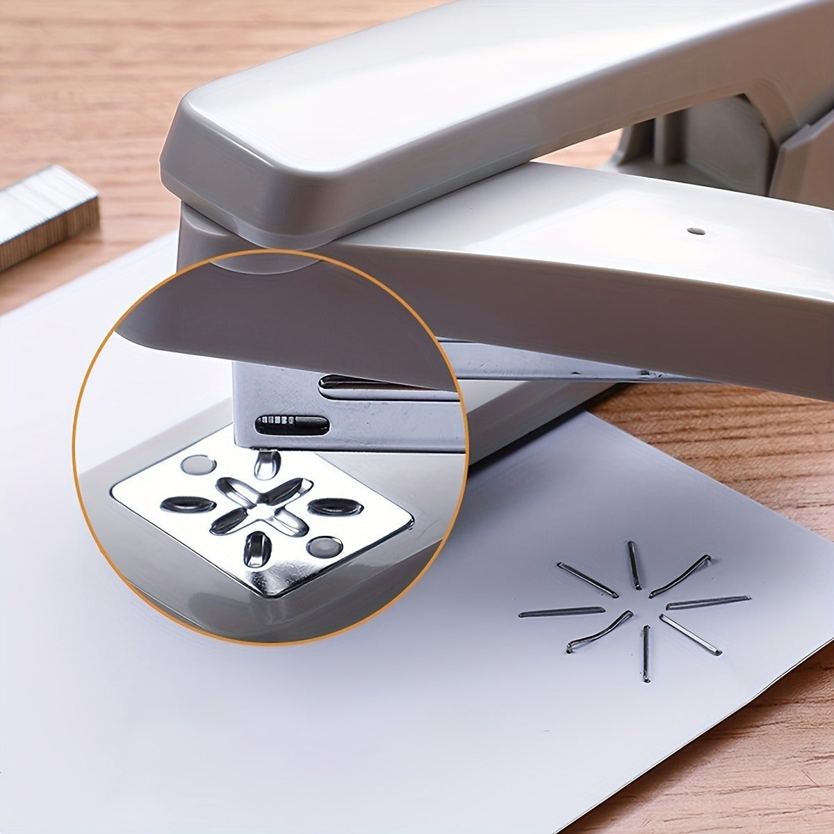 A white desktop stapler that can rotate 360 degrees and staple up to 25 sheets at once.