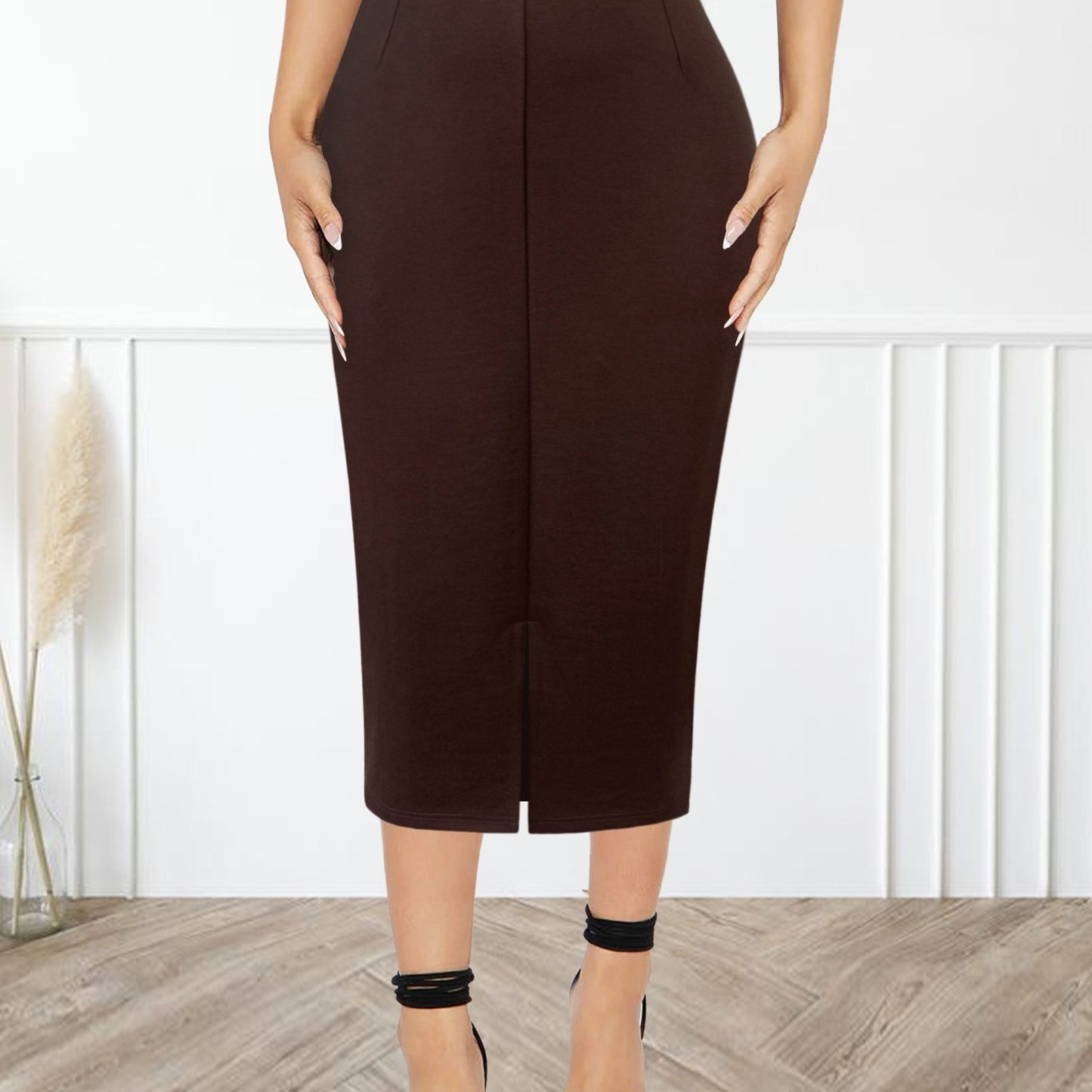 Stylish black midi skirt for women with a chic slim silhouette, high-waisted design, and side slit, made with a stretchy rayon blend ideal for spring/summer fashion.