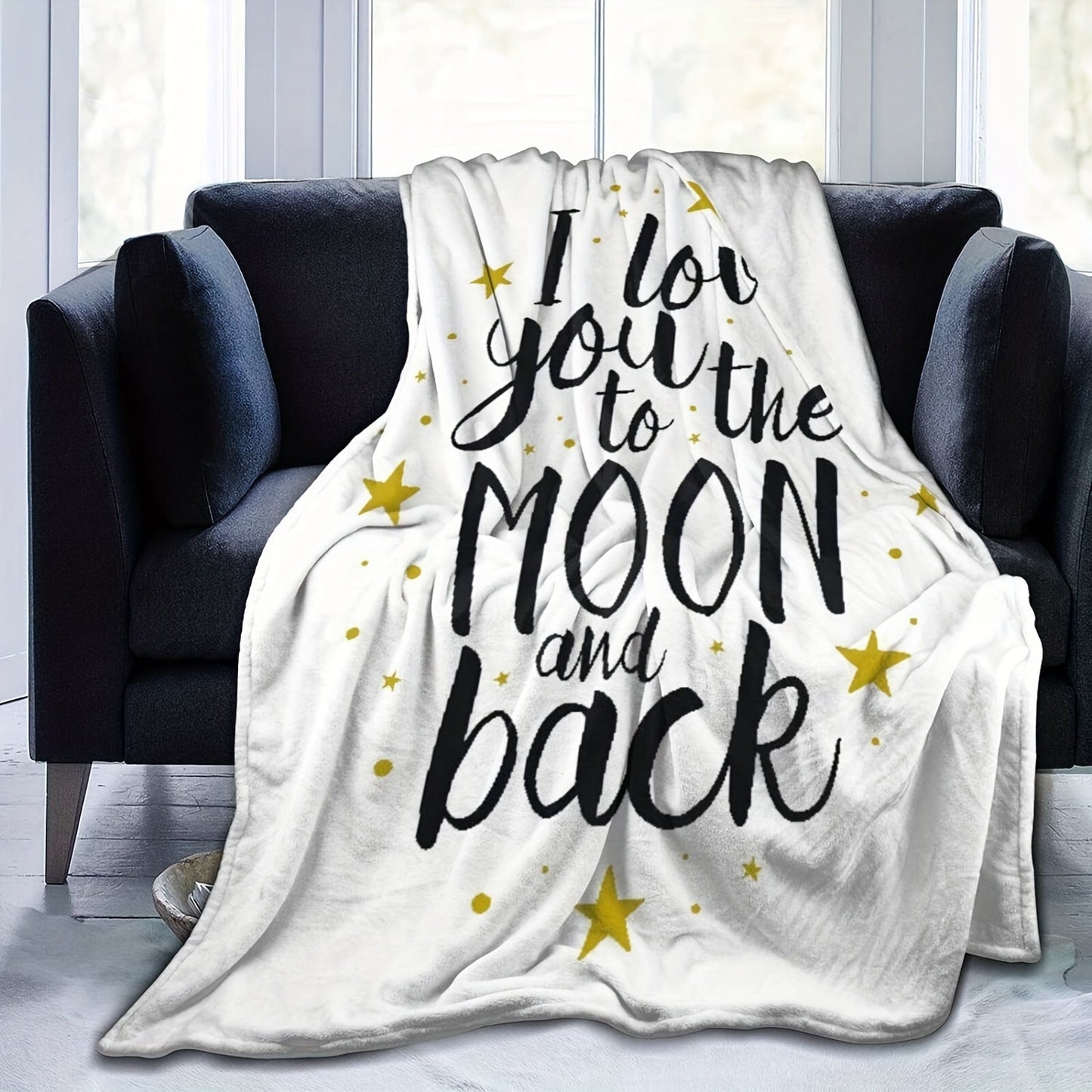 Soft flannel throw blanket with the message "I Love You To The Moon And Back", perfect for adding warmth and style to your home decor. Suitable for couches, beds, sofas, and living rooms.