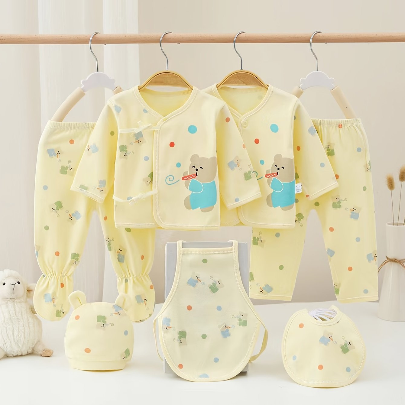 Comfy 7-piece cotton set for baby girl featuring bear and rabbit cartoons. Easy care and versatile wear.