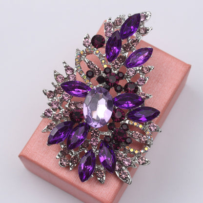 Crystal embellished fashion accessory - vintage rhinestone brooch pin featuring an irregular flower design