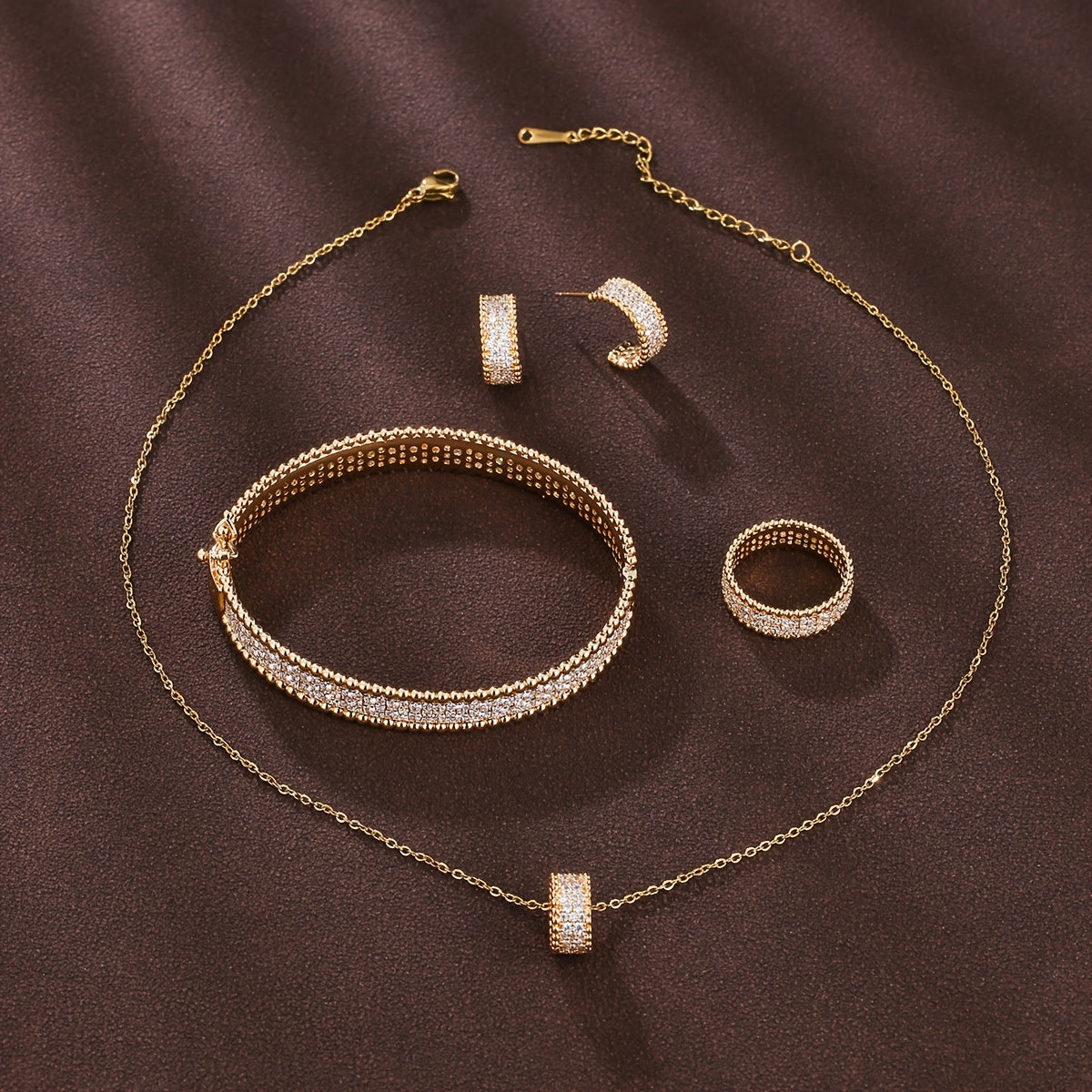 Simple and elegant jewelry set for girls featuring rings, earrings, necklaces, and bracelets with a sleek and luxurious design.