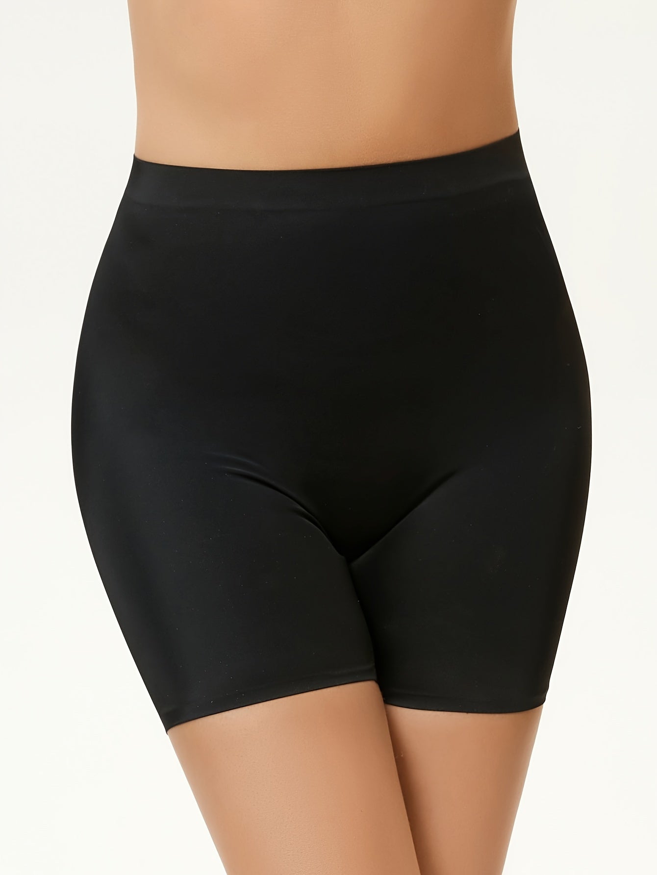 High waisted tummy control sports shorts for women that lift the butt and shape the body, made with breathable fabric.