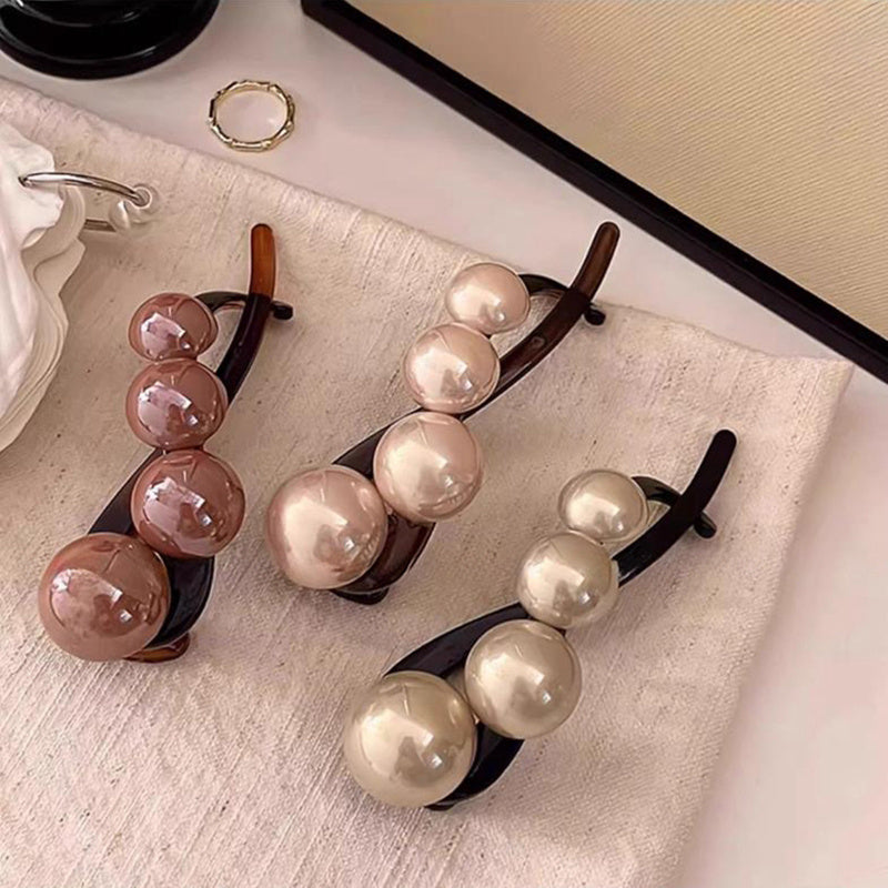 Stylish imitation pearl twist hairpin for daily wear and styling.