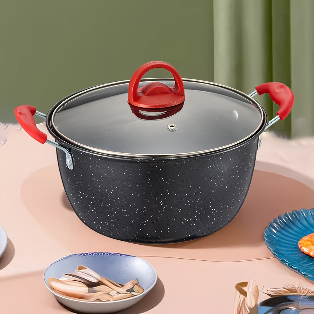 Multi-functional soup pot with a non-stick coating and matching lid, ideal for cooking stews, hot pots, and noodles. Can be used on gas and induction stoves. Features a timeless red and black design.