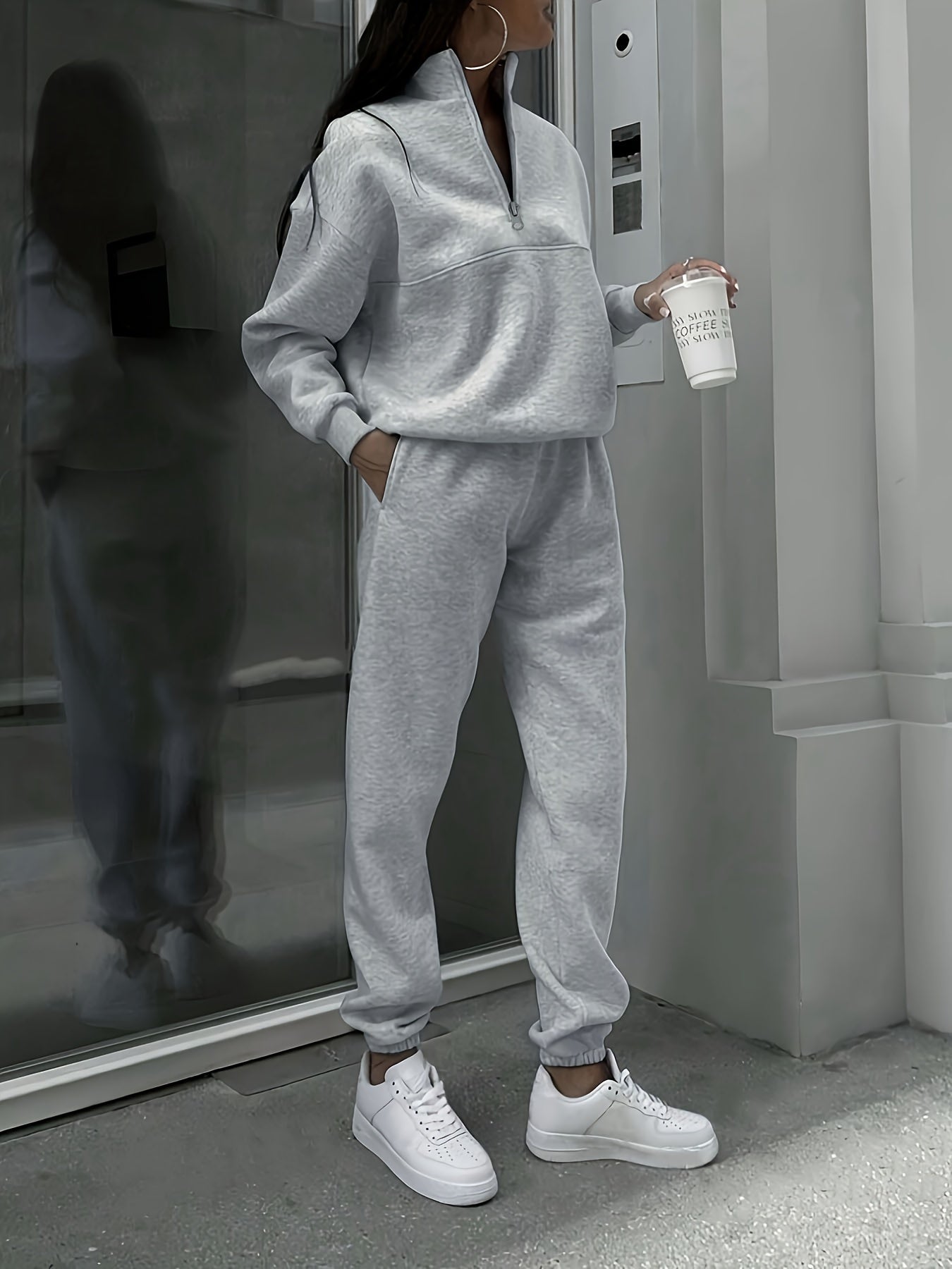 Women's cozy polyester sweatshirt and joggers set in solid color, machine washable, perfect for fall/winter.