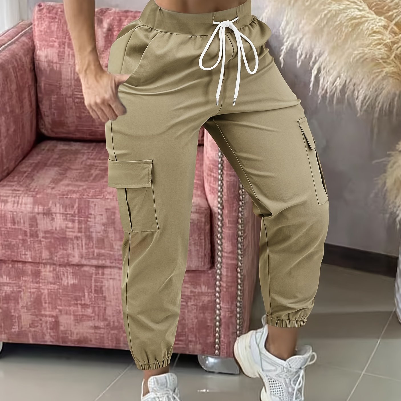 Women's casual cargo pants made of polyester with a drawstring waist.