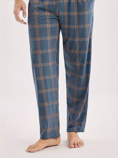 Men's casual blue short-sleeve top and plaid long pants set made of soft polyester for loungewear at home or out.